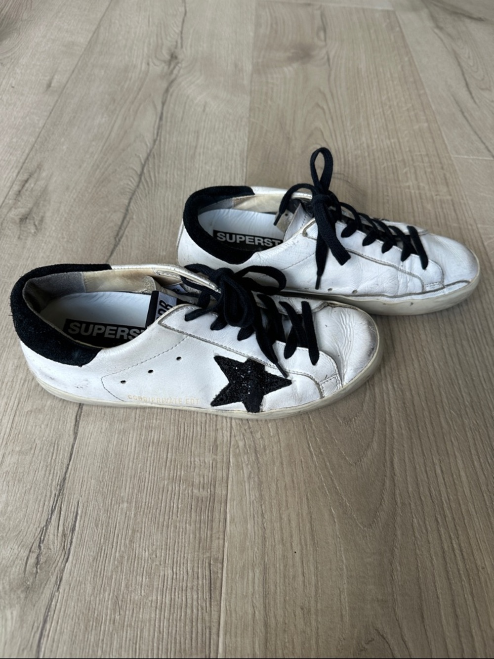 Golden Goose Superstar White Sneakers with Black Star and Black Trim